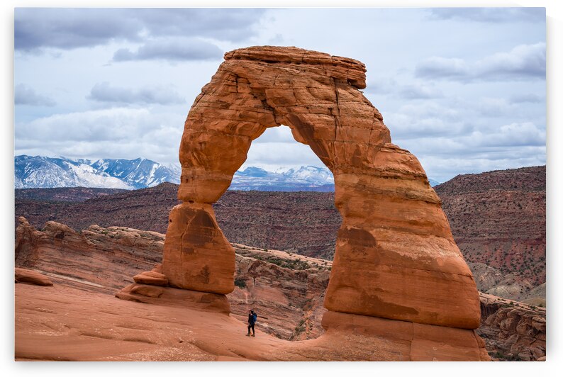 Standing Under Delicate Arch Utah by Jennifer White