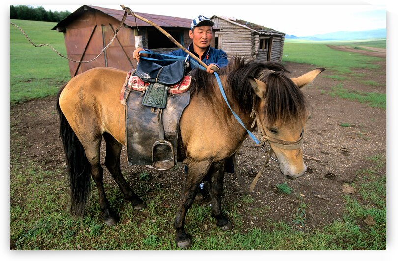 Mongolia. A sheperd in his farm with a horse. by Marco Brivio