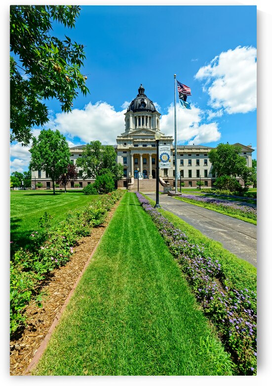 A flower-lined sidewalk leads to the entrance of the State Capitol in Pierre South Dakota USA by David Reinhold