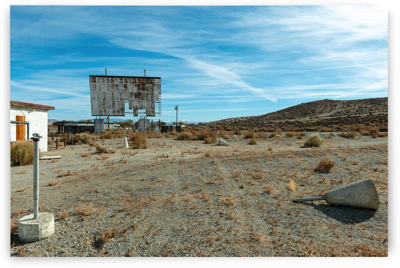 Abandoned drive in theater with a broken screen by David Reinhold