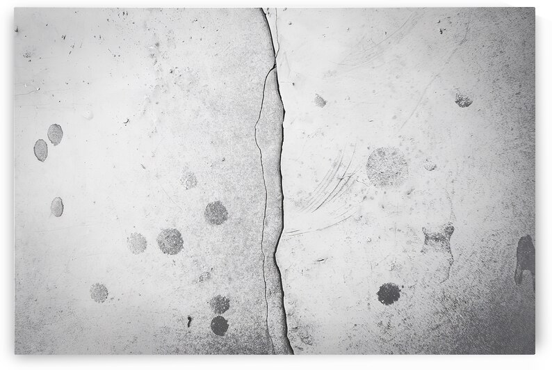 A photo of a textured wall with a large jagged cr by Raluca Ciobanu