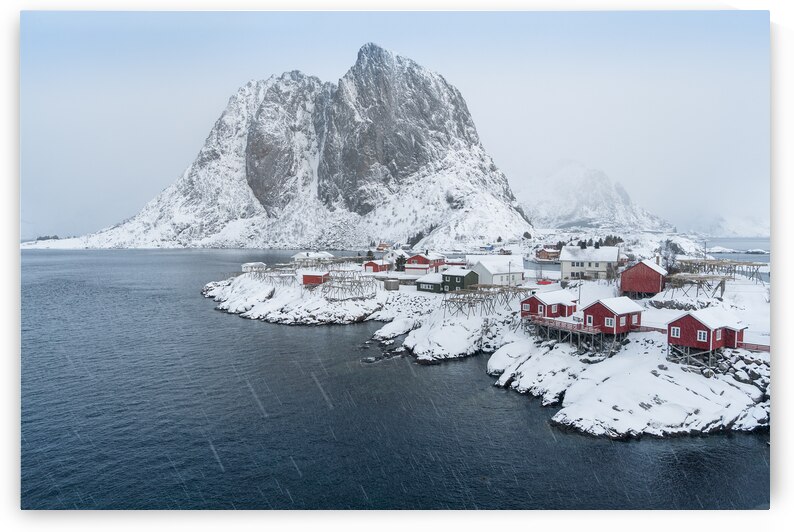 Small red huts in the Snow in Norway by Andreas Wonisch