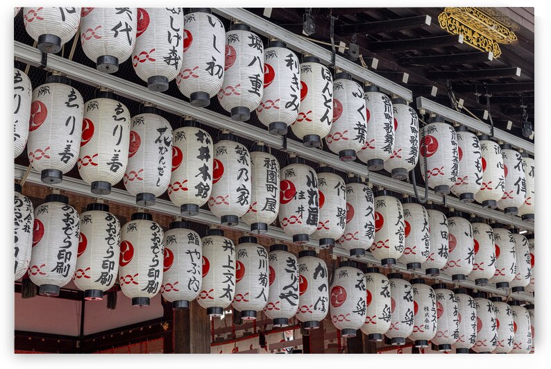 Rows of japanese lanterns hanging in a shinto shrine by Gualtiero Boffi