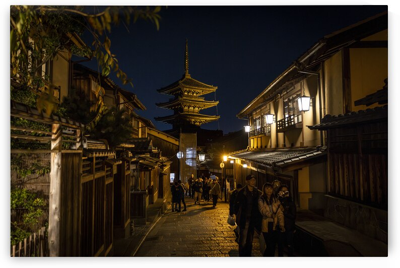 Tourists walking down ancient street with yasaka pagoda by Gualtiero Boffi