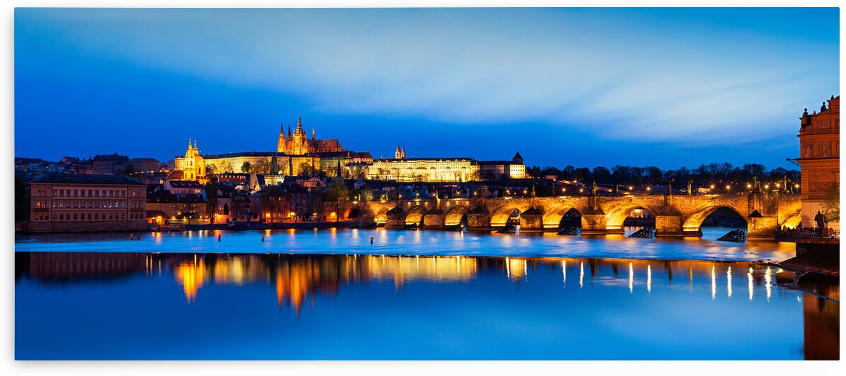 View of Charles Bridge Karluv most and Prague Castle Prazsky hrad in twilight. Panorama by Dmitry Rukhlenko