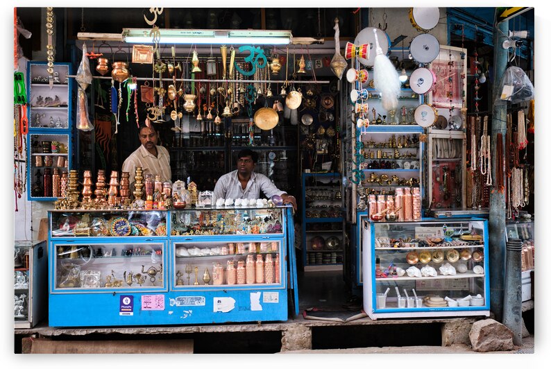 Brass ware shop with vendors in Pushkar Rajasthan India by Dmitry Rukhlenko