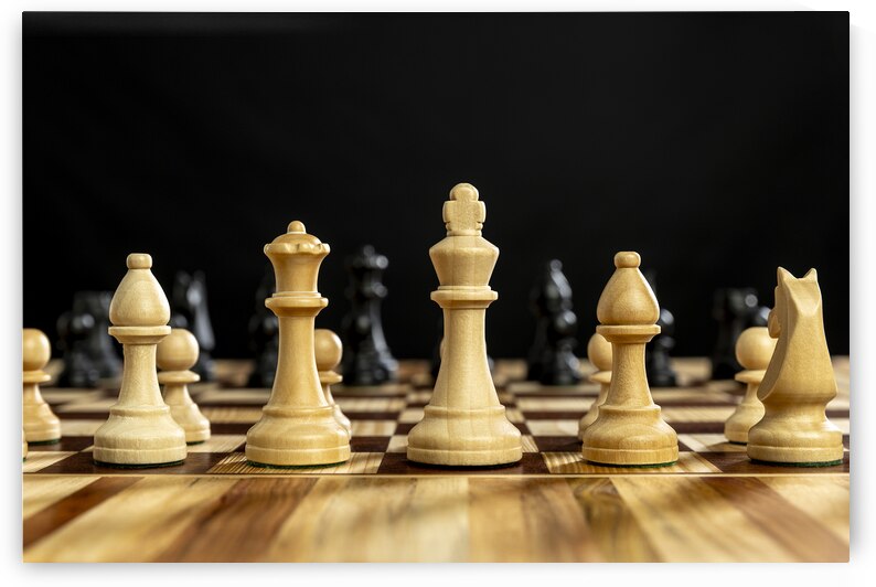 Chess pieces on wooden chessboard  by Gualtiero Boffi