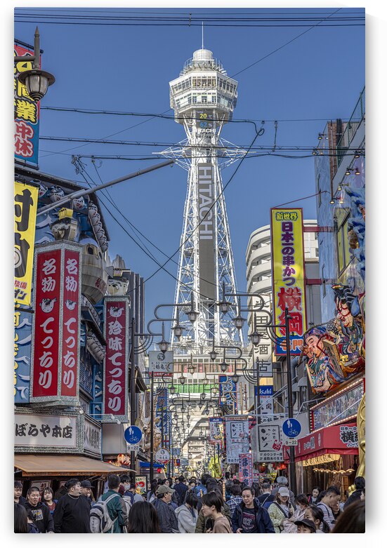 shinsekai district with tsutenkaku tower standing tall in the ba by Gualtiero Boffi