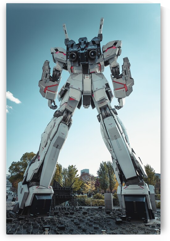 Imposing gundam statue standing tall against a clear blue sky by Gualtiero Boffi