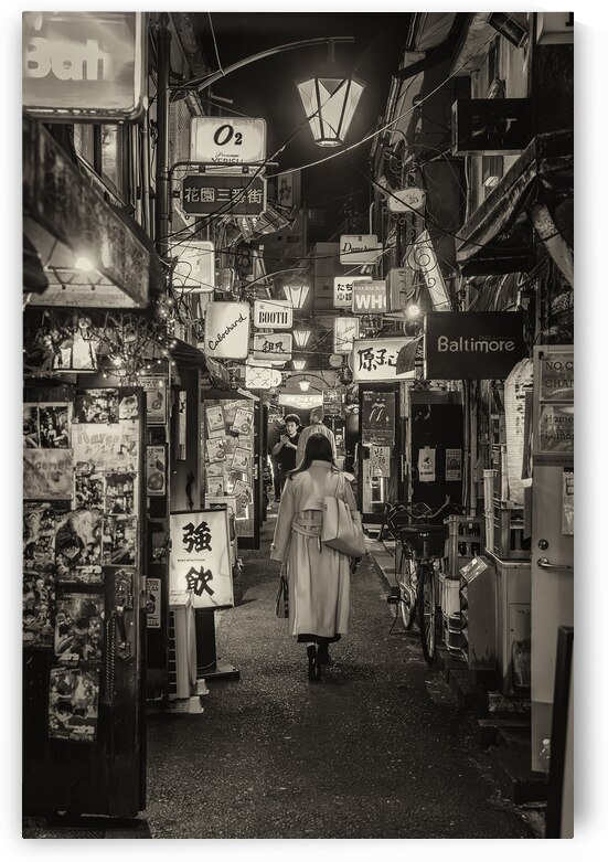 Woman walking through alley in shinjuku by Gualtiero Boffi