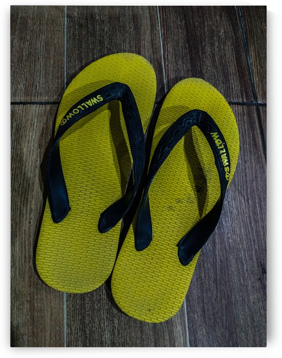 Yellow and Black Flip Flops on Wooden Floor by urbancamshot