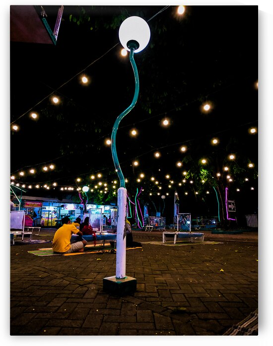 Nighttime Outdoor Gathering with Decorative Lights by urbancamshot