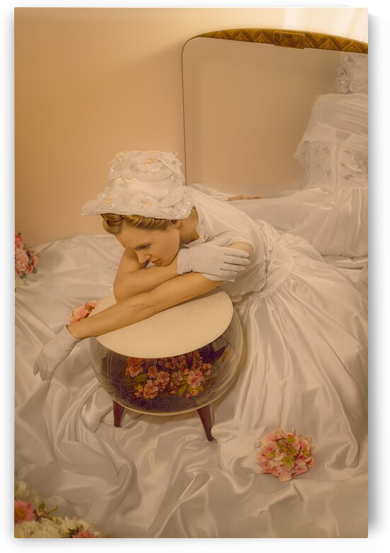 Vintage portrait of a young 1950s woman wearing a wedding dress resting on an inflatable terrarium ottoman in front of a mirror by Artmood Visualz