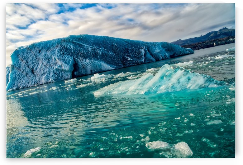 Melting ice breaking off from isolated iceberg -- Jokulsarlon Iceland by Jason Wen Bin TONG 