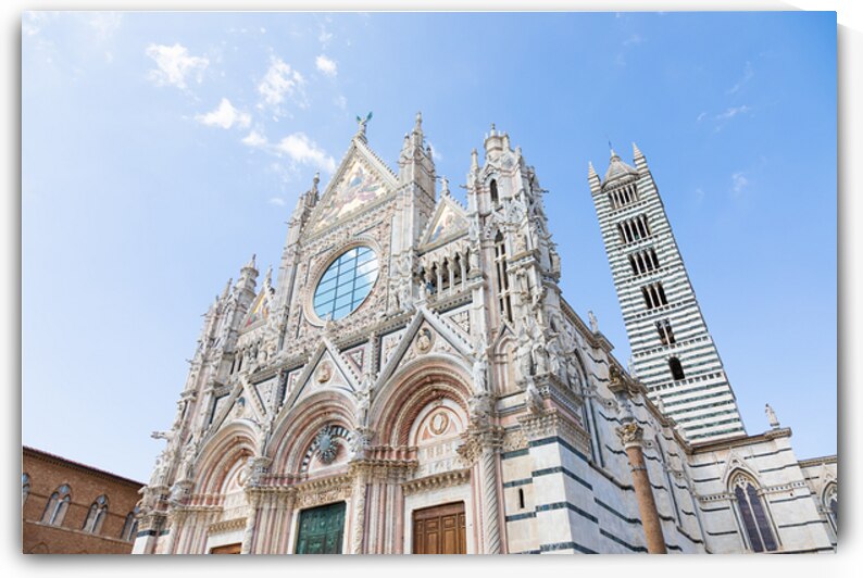 Siena cathedral in Italy. White marbles with blue sky famous la by Paolo Modena