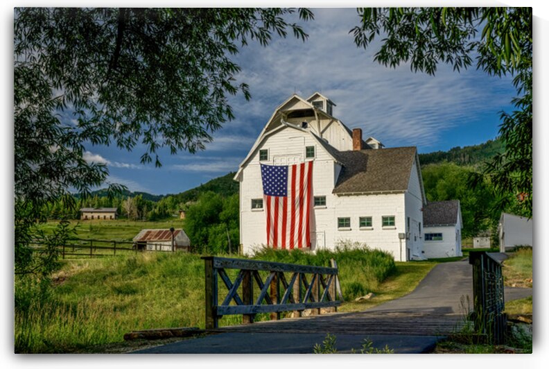 McPolin Barn with Flag by Life s Trail Photography