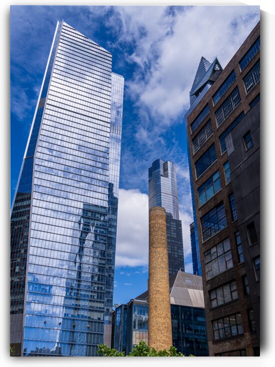 Looking up at modern buildings by brick chimney in Hudson Yards by Steve Heap