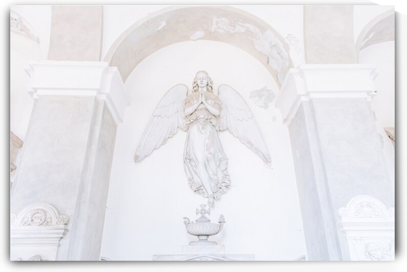 Ancient statue of angel in Italian old cemetery. Religious sculp by Paolo Modena