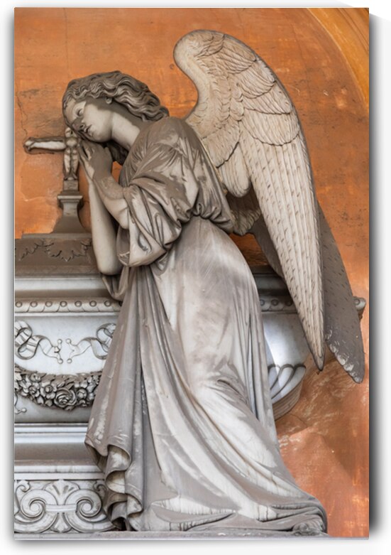 Antique statue in old European cemetery. Angel praying and cover by Paolo Modena