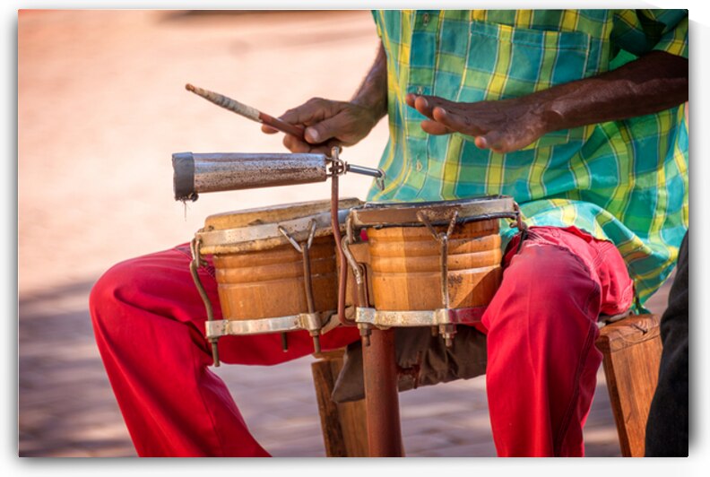Street musician playing drums Cuba by DELPHIMAGES
