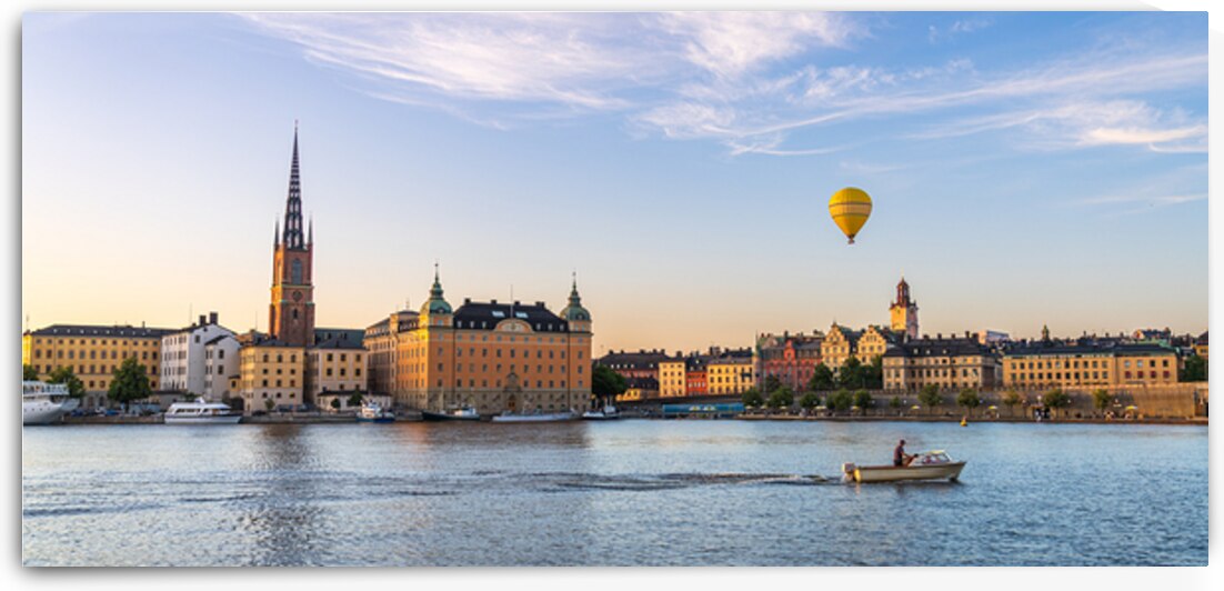 A boat passing by Riddarholmen Stockholm Sweden late summer evening by John Nilsson