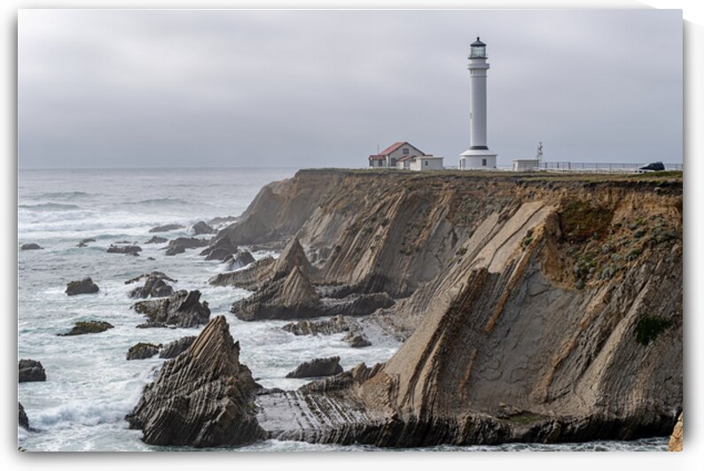 Point Arena Lighthouse with dramatic rocks by Lisa von Biela