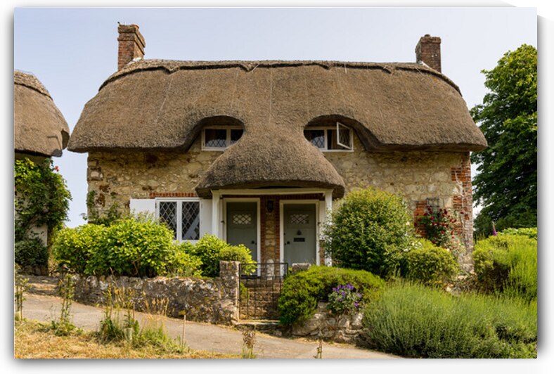 Pair of cute thatched cottages on hill in Godshill on the Isle o by Steve Heap