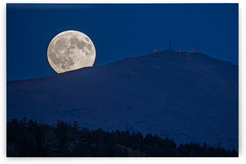 Moon peeks over mountain by Geoffrey Prior