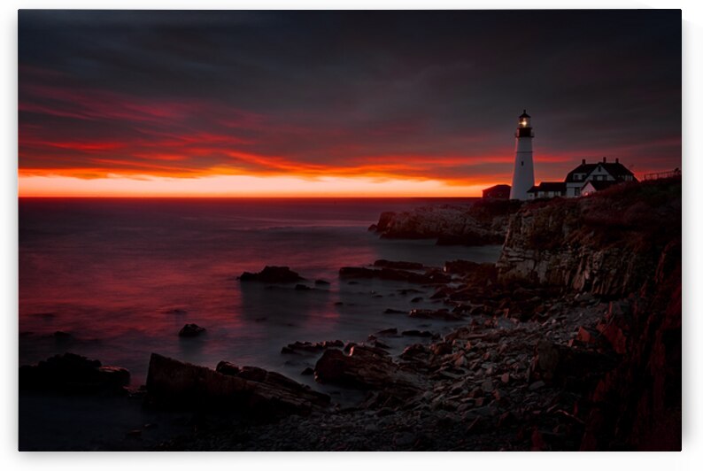 Crimson Skies Over Portland Head Light by Rick Berk