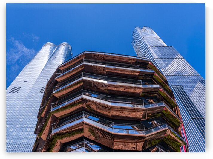 Reflective surface of the Vessel with a skyscraper behind with c by Steve Heap