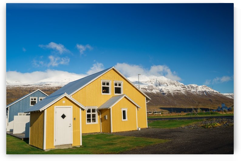 Vibrant Icelandic House under the mountain range  by Jason Wen Bin TONG 
