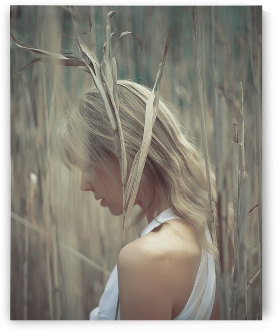 Beautiful young blonde woman wearing a white summer dress standing in a field of reeds meditating with her eyes closed by Artmood Visualz