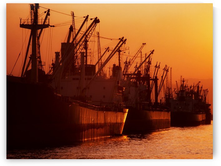 Shipping Freighters At Sunset by PacificStock