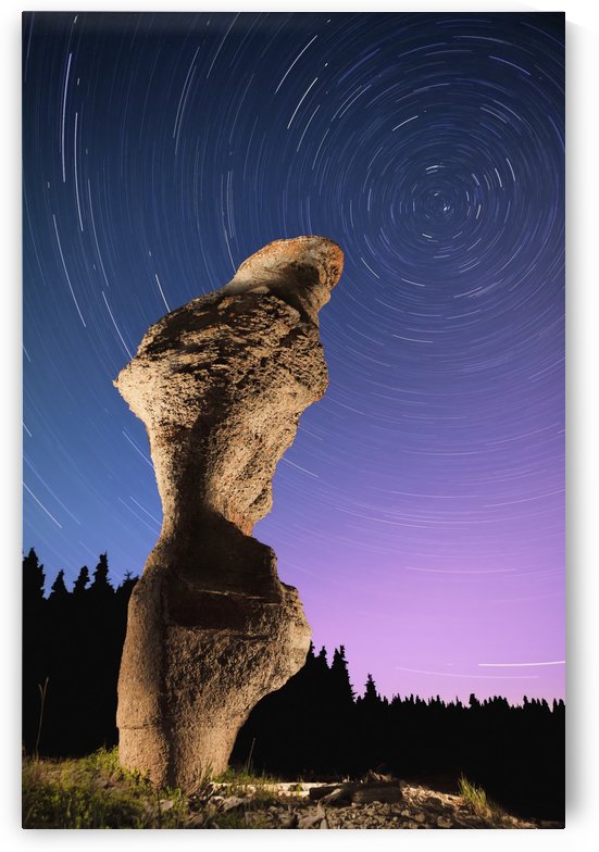 Light painting on monolith and star trails, Anse des Bonnes Femmes at Ile Niapiskau, Mingan Archipelago National Park Reserve of Canada, Cote-Nord, Duplessis region; Quebec, Canada by PacificStock
