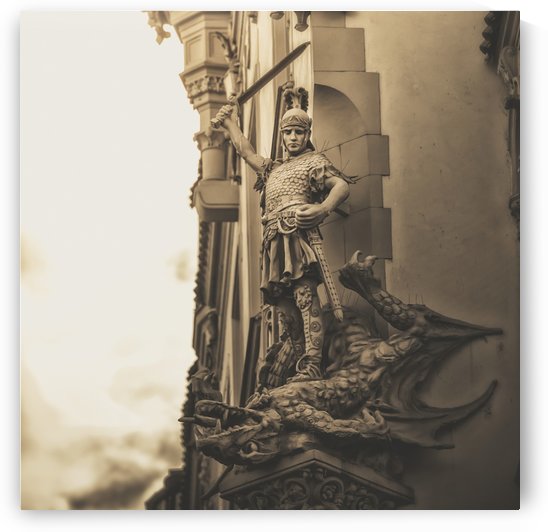 Statue on the side of a building of a warrior slaying a dragon; Prague, Czech Republic by PacificStock