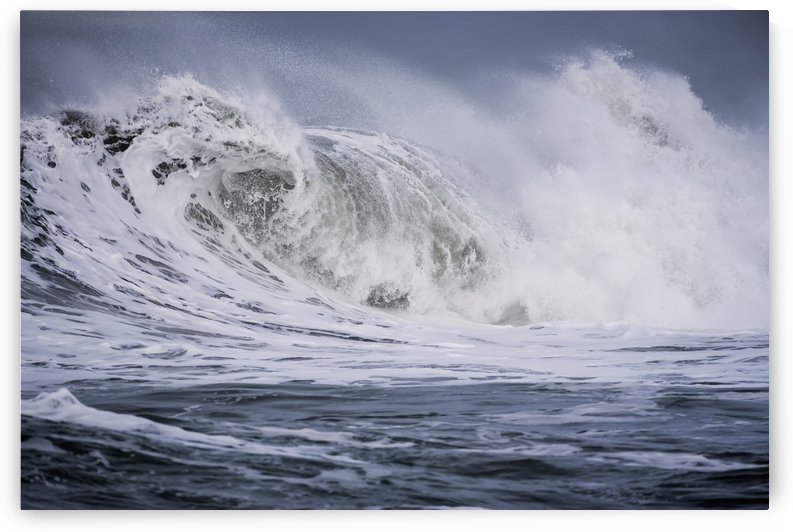 A large wave breaks on a stormy morning; Seaside, Oregon, United States of America by PacificStock