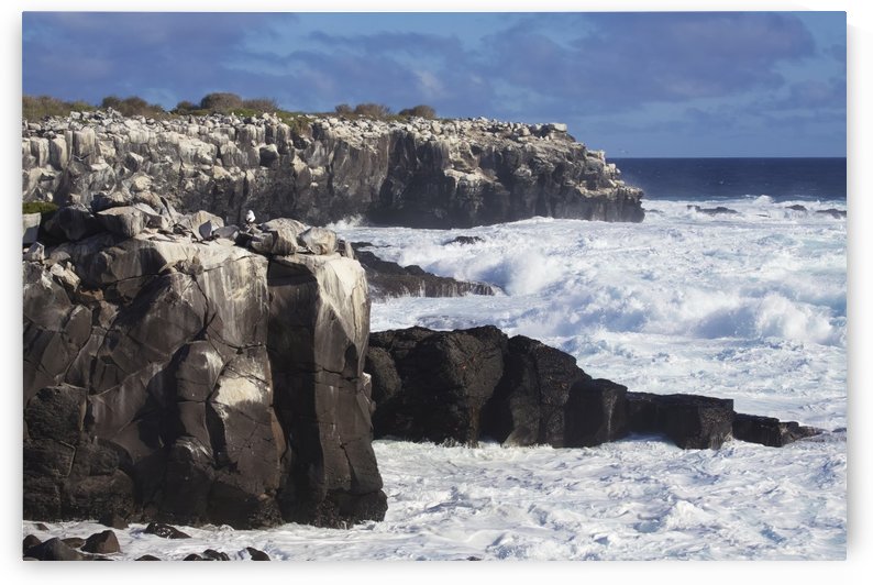 Dramatic cliffs,with rocky bay and crashing surf by PacificStock