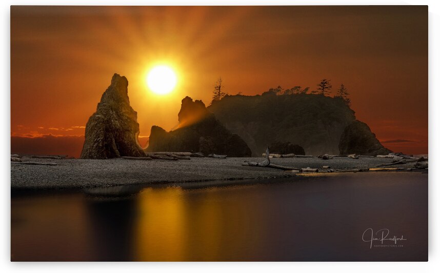 Sun on seastacks by Jim Radford