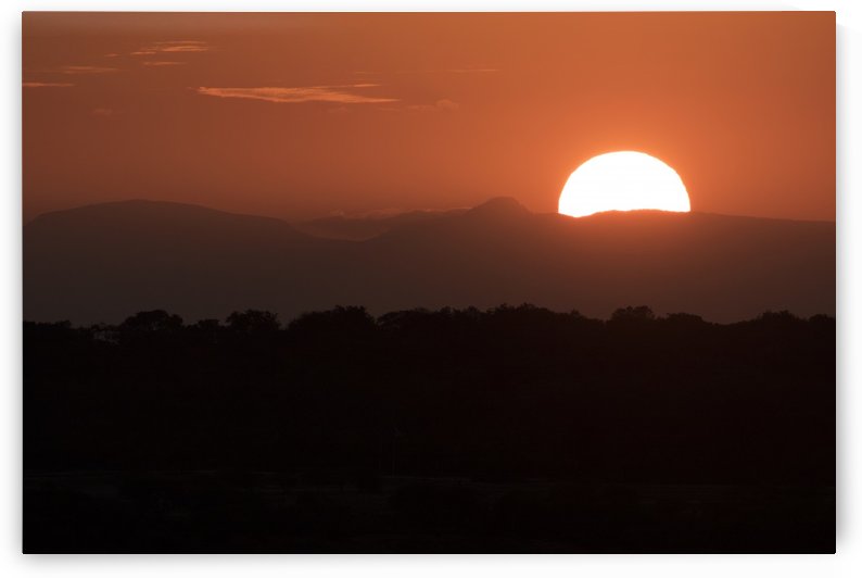 Setting sun overtop of the African landscape; South Africa by PacificStock