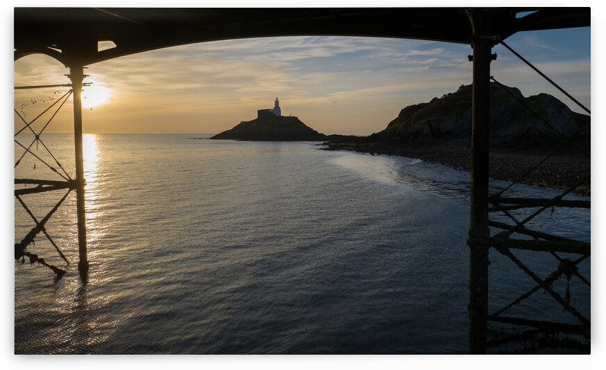 Sunrise at Mumbles lighthouse by Leighton Collins