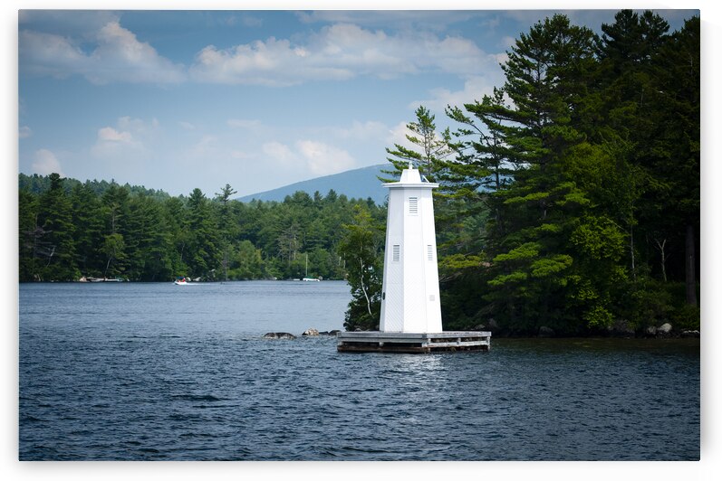Herrick Cove Light by Rocky Shoreline of Lake Sunapee in New Hampshire by Allan Wood