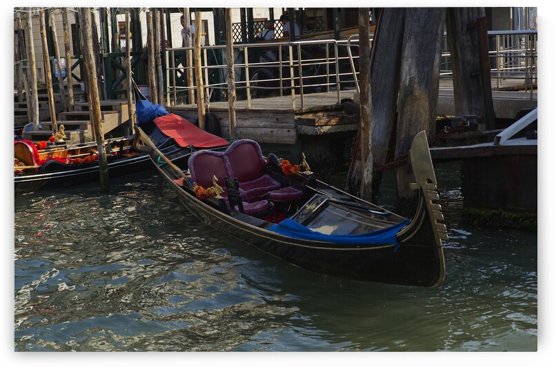 A single gondola in Venice resting for lunch by Iris H Richardson