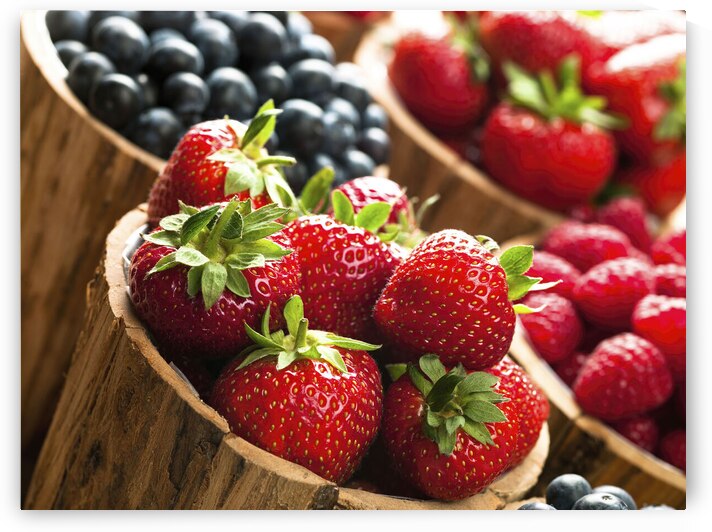 Berries in wooden pots by Assaf Frank