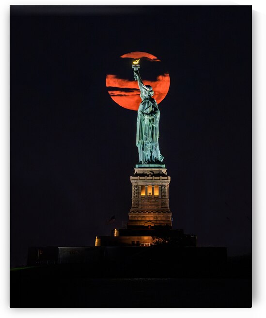 Sturgeon Moon Rising behind Lady Liberty by Geoffrey Prior