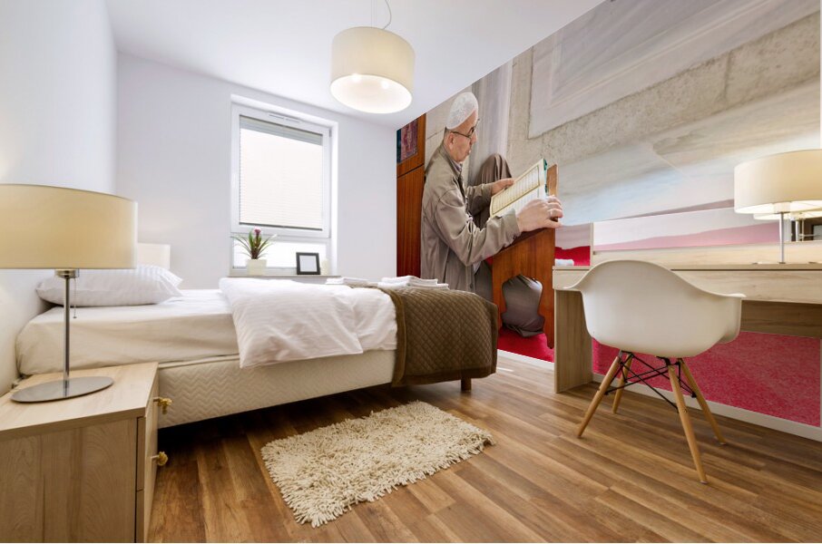 Istanbul Turkey. Muslim believer praying and reading Koran in the Fatih Mosque Mural print