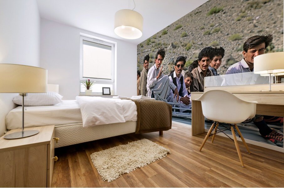 Pakistan. People travelling on the roof of a van Mural print