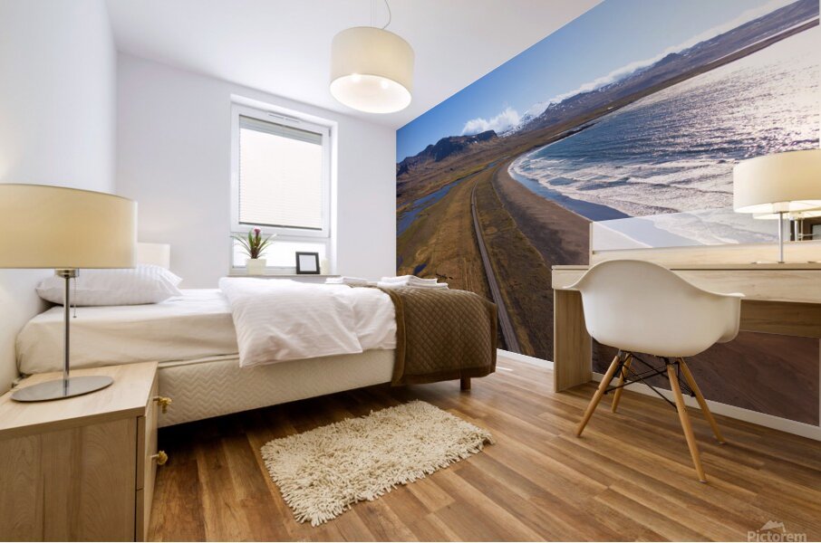 Iceland scenic route Snaefellsnes pensinsula volcano in the background covered in snow empty road with the ocean and waves. Mural print