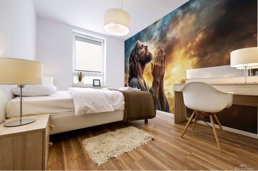 Spiritual reflection at sunset with Jesus Christ in prayer amidst dramatic clouds Mural print