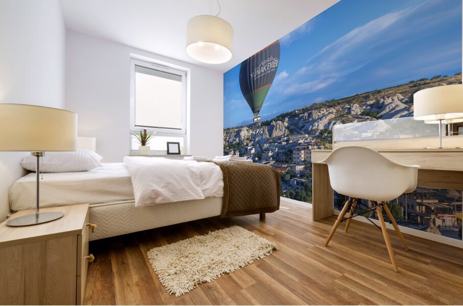 hot air balloons fly over the town Mural print