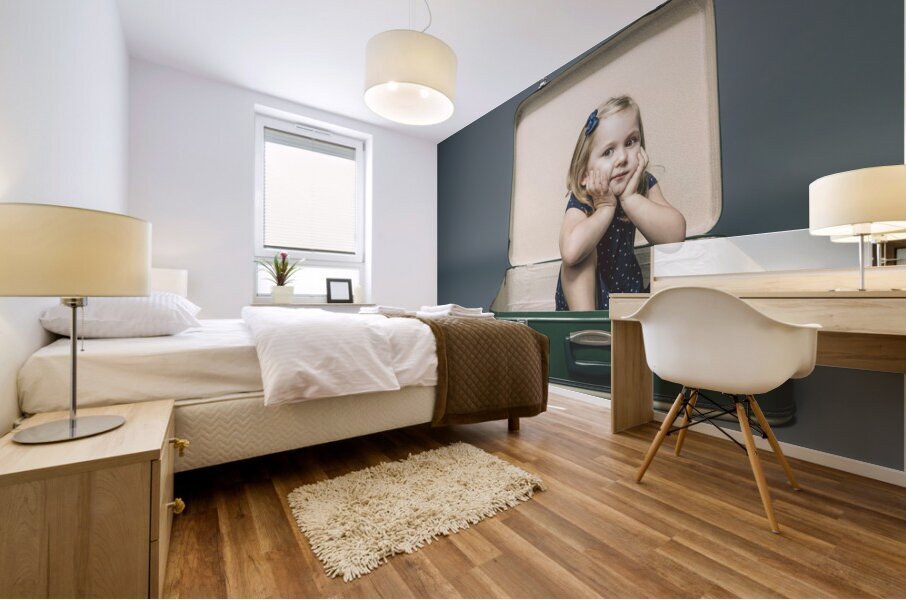girl with dreamy expression sitting inside a vintage suitcase. Mural print